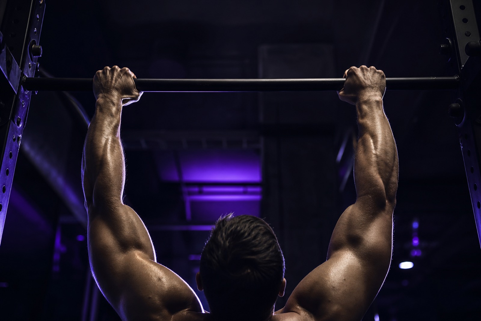 Athlete practicing an assisted pull-up progression